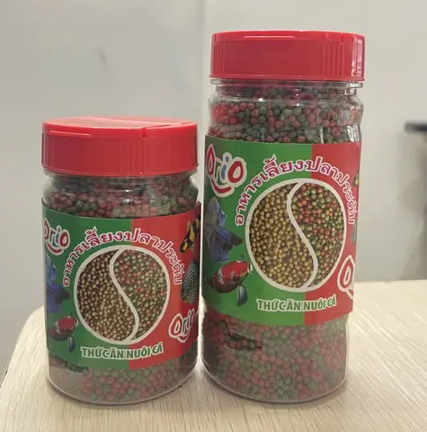 Thức Ăn Cá Cảnh Orio Cho Cá Mau Lớn Lên Màu Đẹp Hủ 150g Thức Ăn Cá Cảnh Orio Cho Cá Mau Lớn Lên Màu Đẹp Hủ 150g